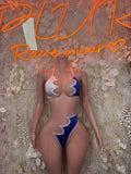 Two-piece bikini in white and dark blue with scalloped trim and tied straps