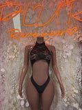Black two-piece bikini with lace halter top and cheeky bottom, front view