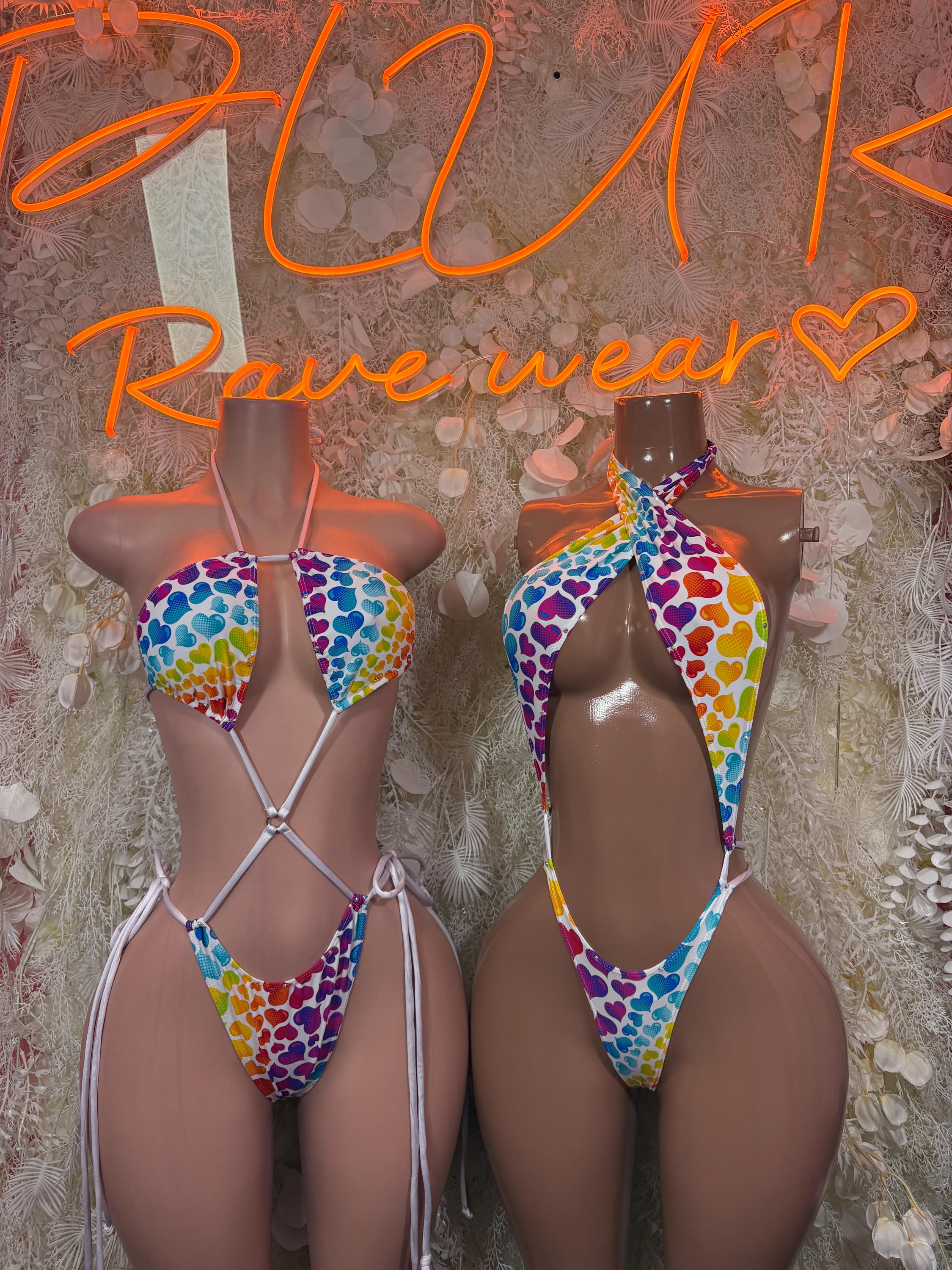 Rainbow hearts one-piece bodysuit on two models, crisscross straps and open back