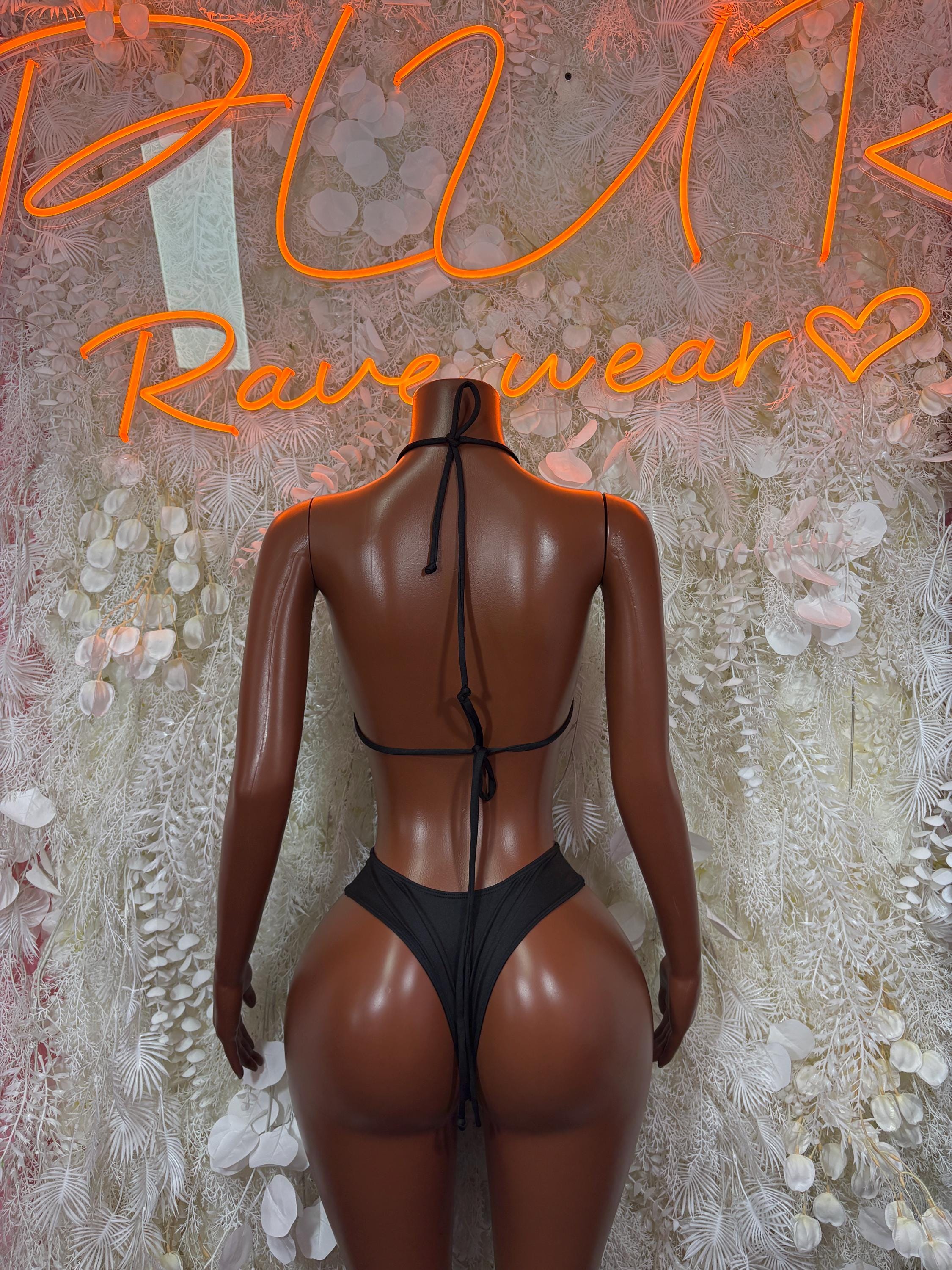 Black bikini from back view with thin tie straps and high-cut bottoms