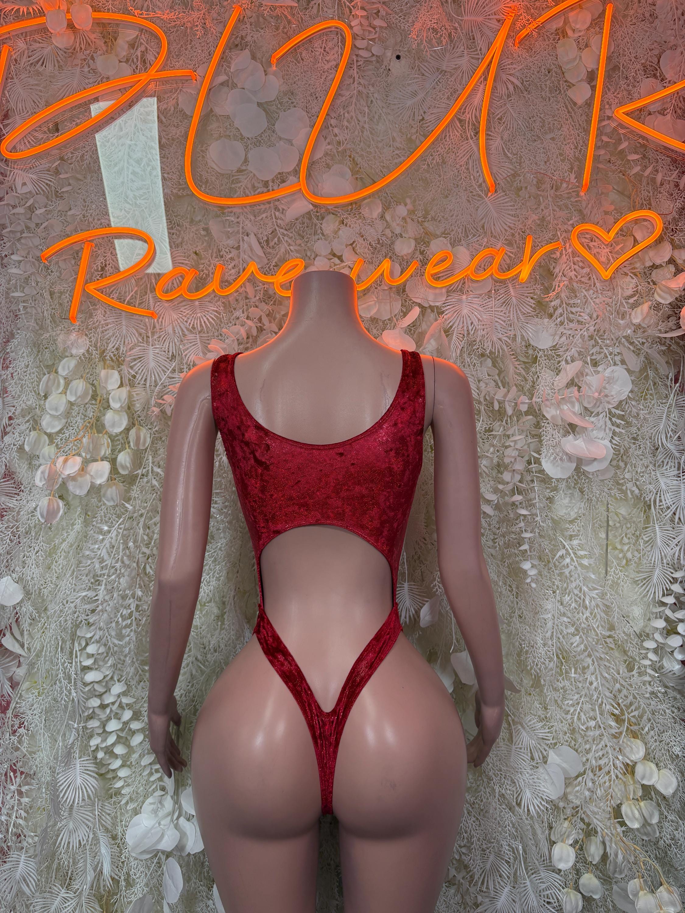 Red sleeveless one-piece bodysuit with scoop neckline and high-leg cutout