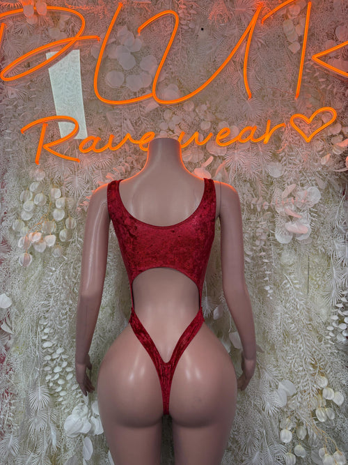 Red sleeveless one-piece bodysuit with scoop neckline and high-leg cutout