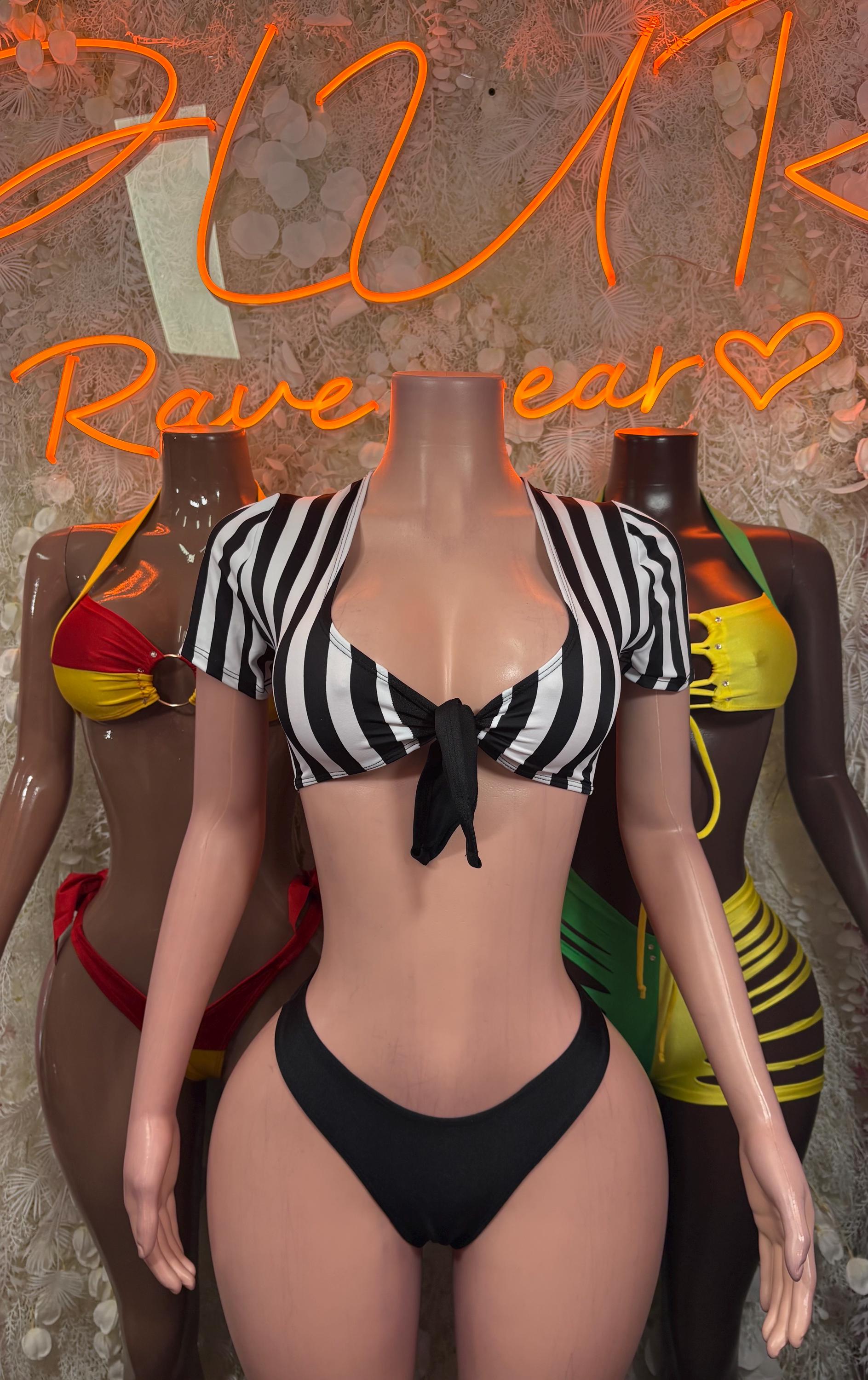 Referee bikini costume with striped crop top, black bikini bottom, red and yellow arm cuffs
