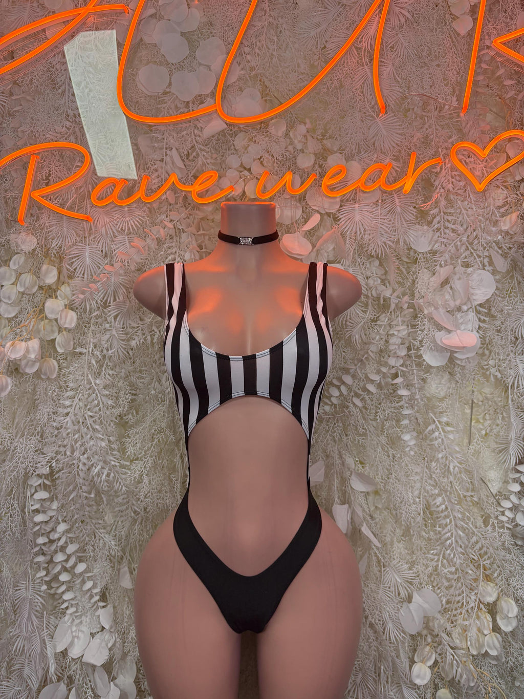 Striped cutout bodysuit, sleeveless black-and-white stripes with front V cutout