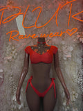 Red two-piece bikini set with choker; ruched bra top and tied string bottoms