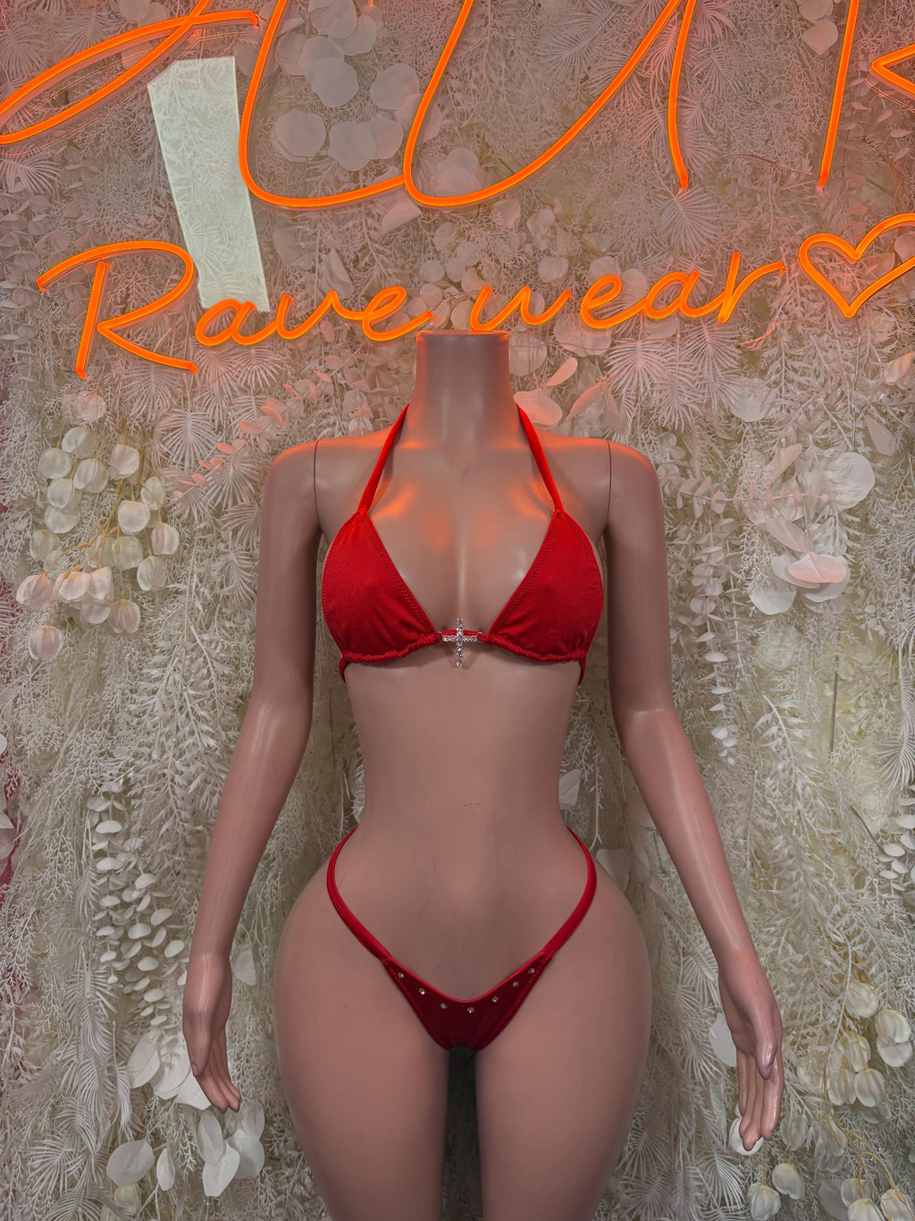 Red triangle bikini with tie straps and glittery center detail; string bottom