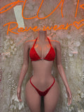 Red triangle bikini with tie straps and glittery center detail; string bottom