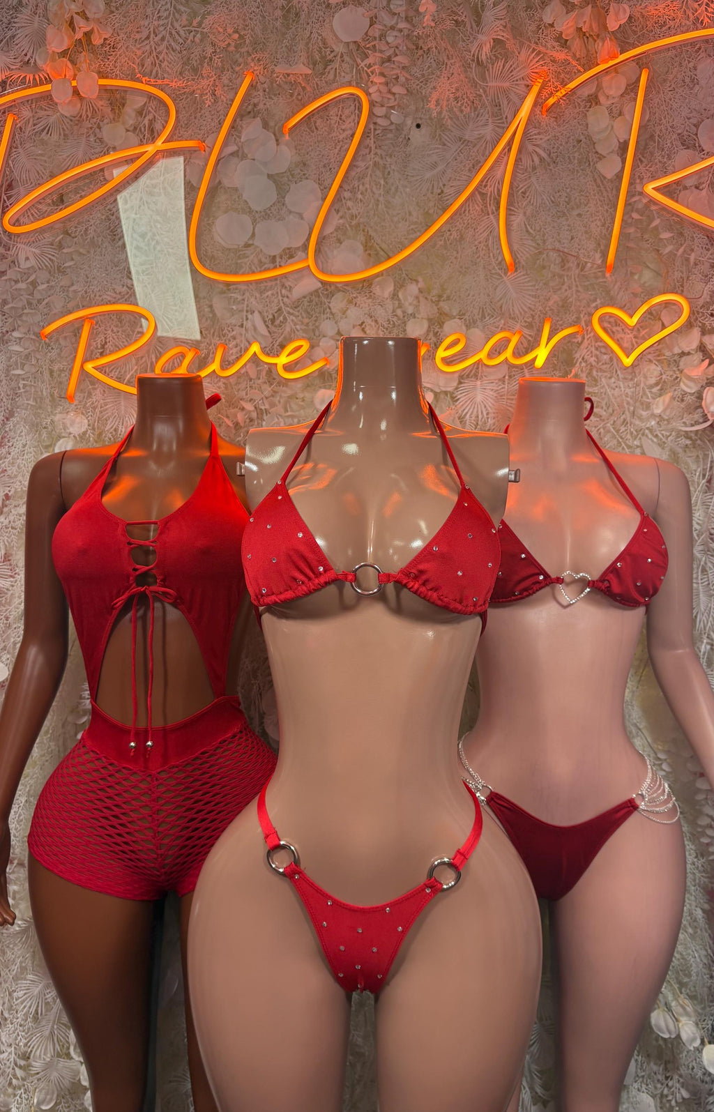 Set of red fishnet bodysuits with halter bra tops and high-cut bottoms