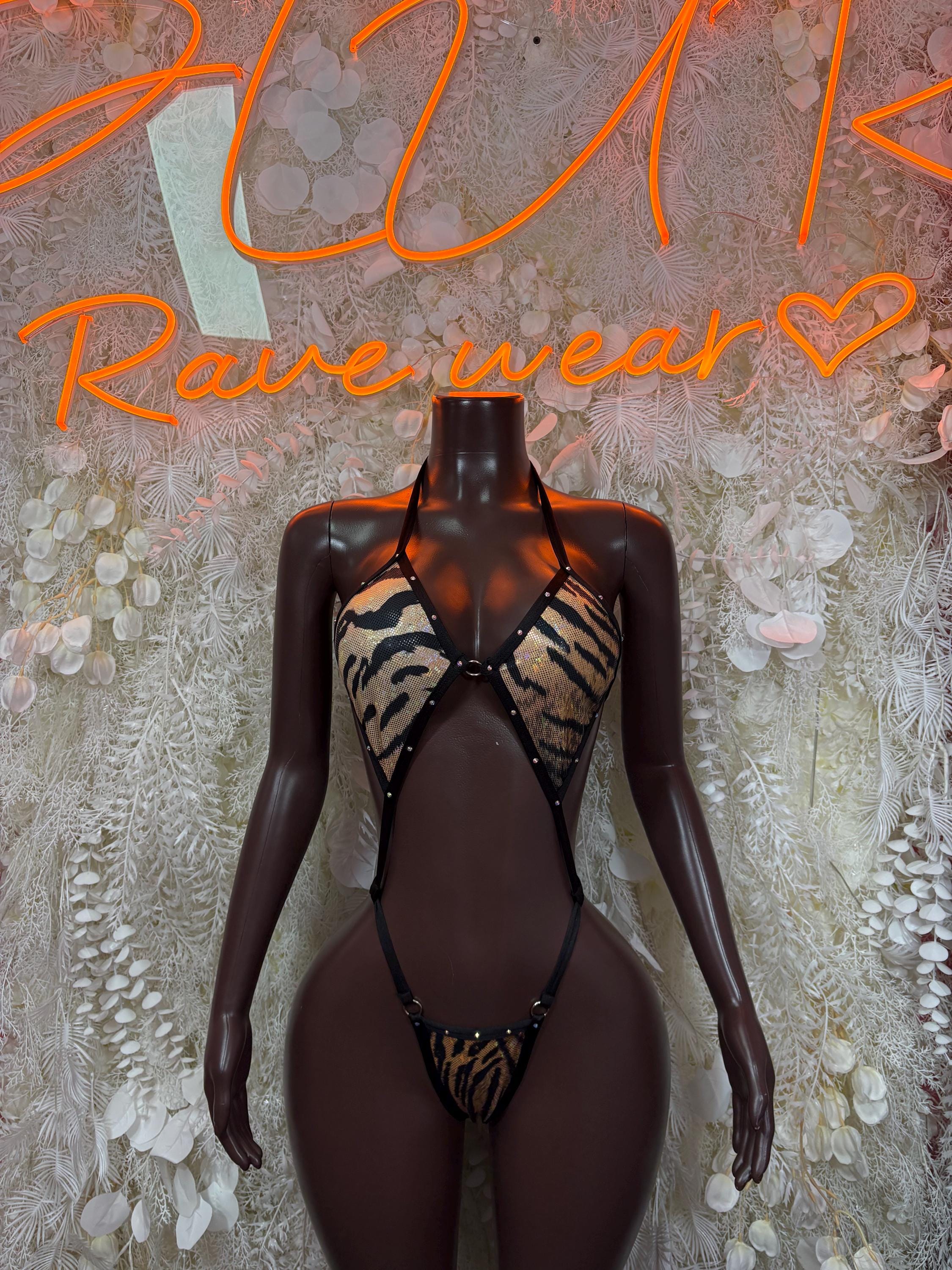 Tiger-print halter bodysuit with open sides, front hook closure, black mesh lingerie