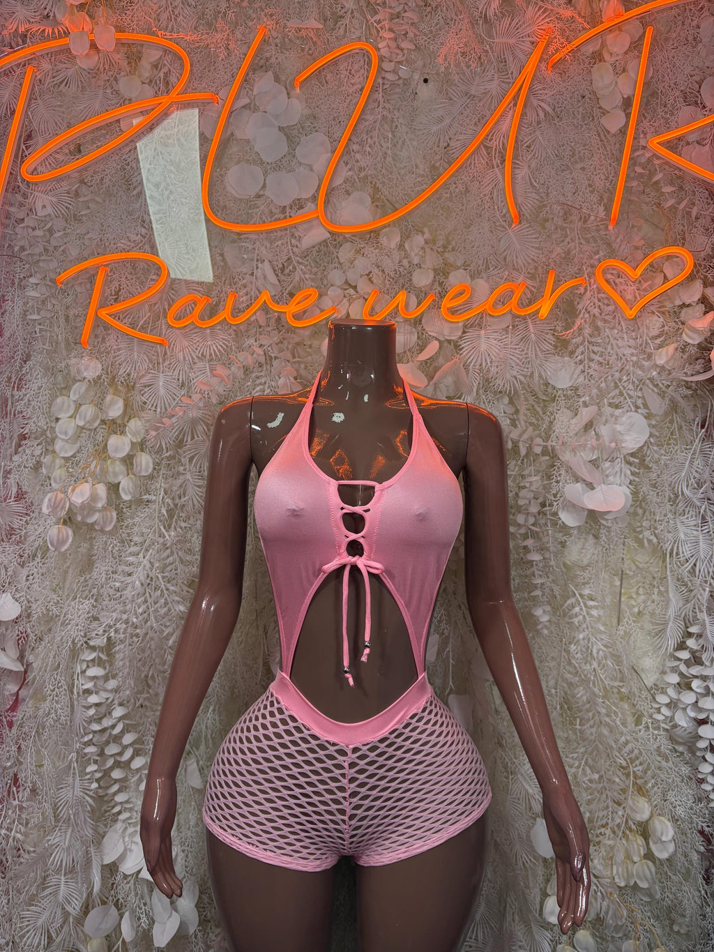 Pink fishnet two-piece set with halter top and shorts, open back straps