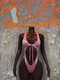 Pink one-piece bodysuit with bow at neckline and low back cutout