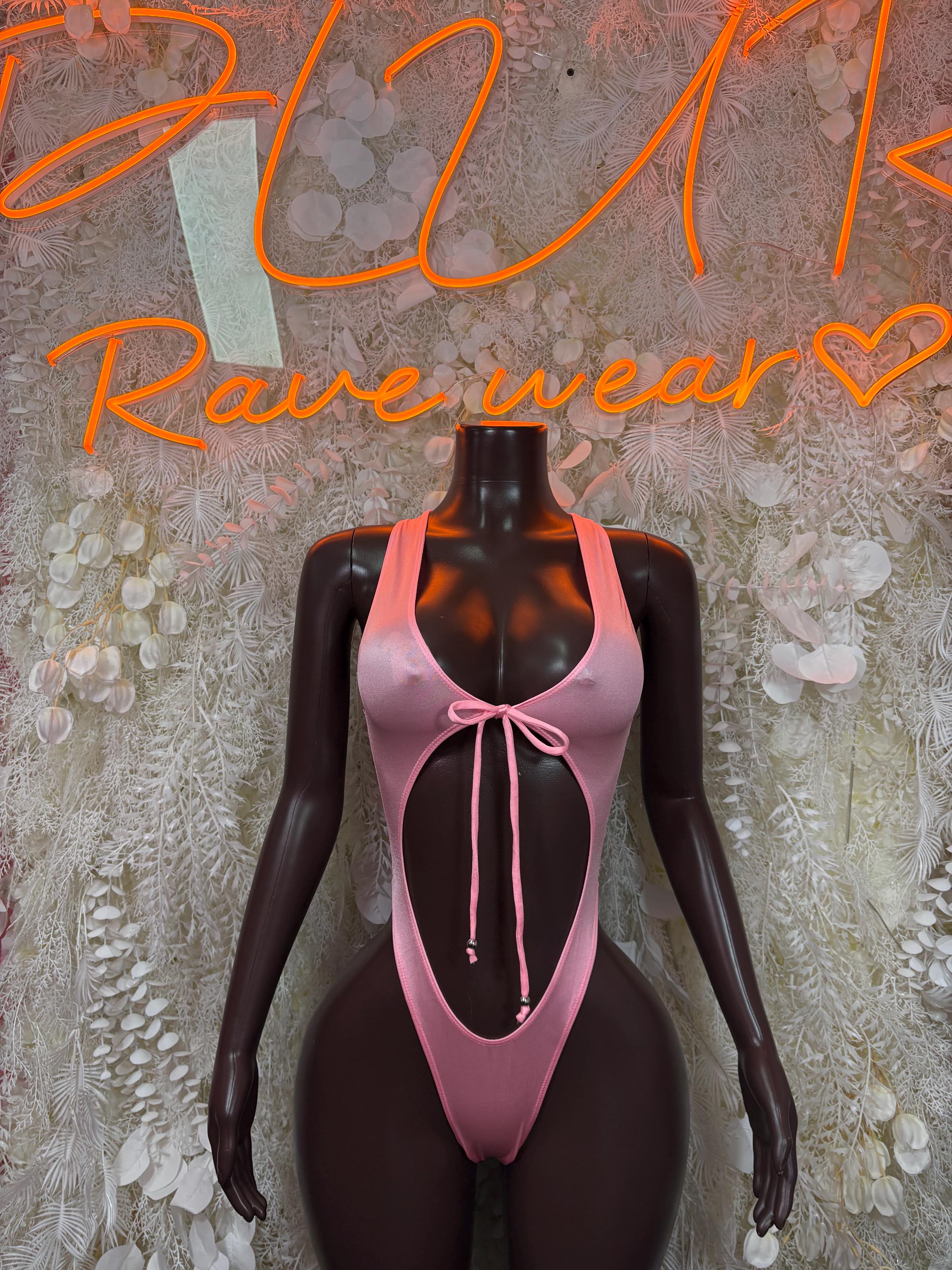 Pink one-piece bodysuit with bow at neckline and low back cutout