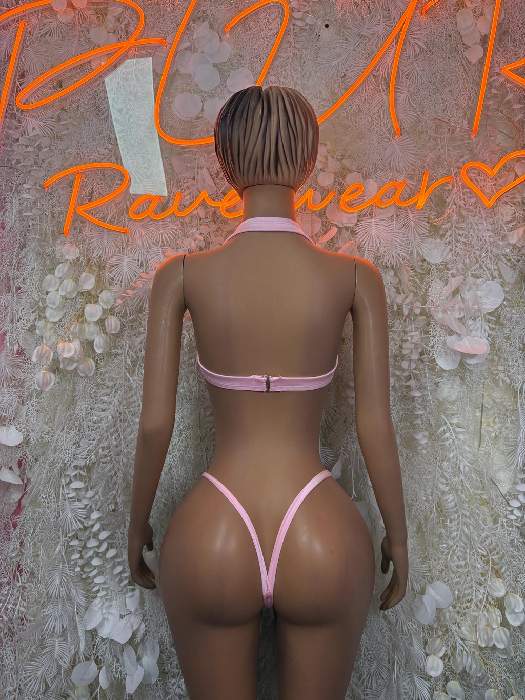 Baby pink lace rave two-piece set, back view with halter bra and V-back bikini bottoms