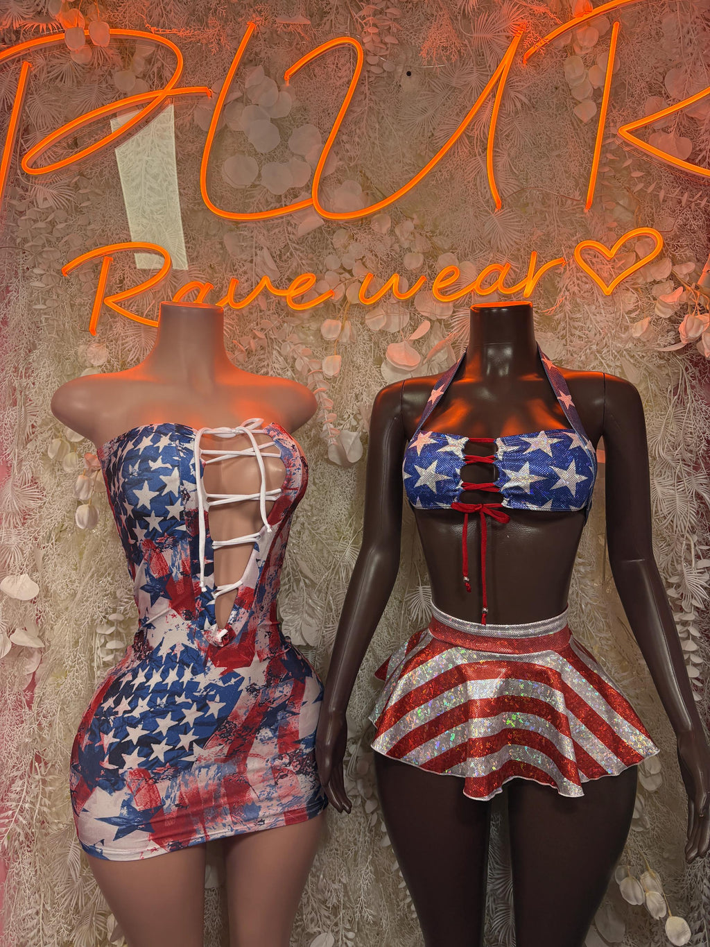 Stars and stripes strapless dress with lace-up back on two mannequins
