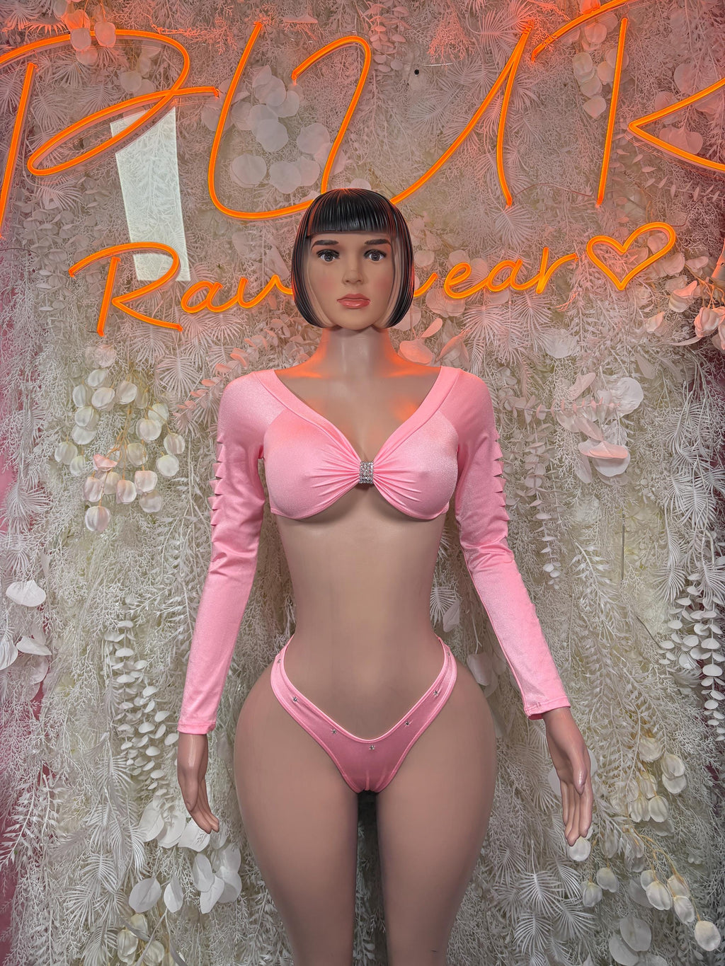 Pink two-piece rave outfit: long-sleeve twist-front top with matching thong bikini bottoms