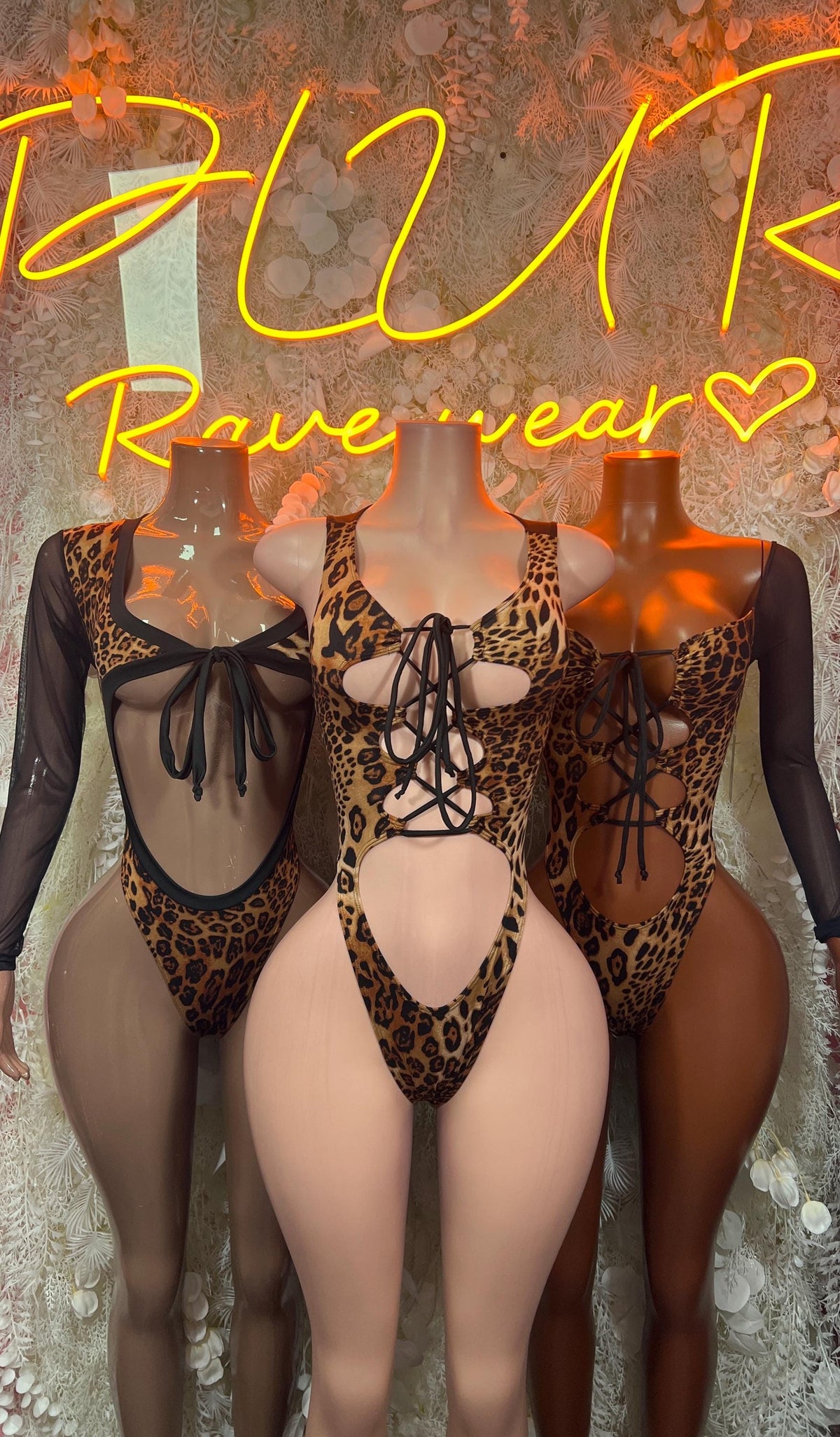 Leopard print one-piece bodysuit with open back and tied strap details