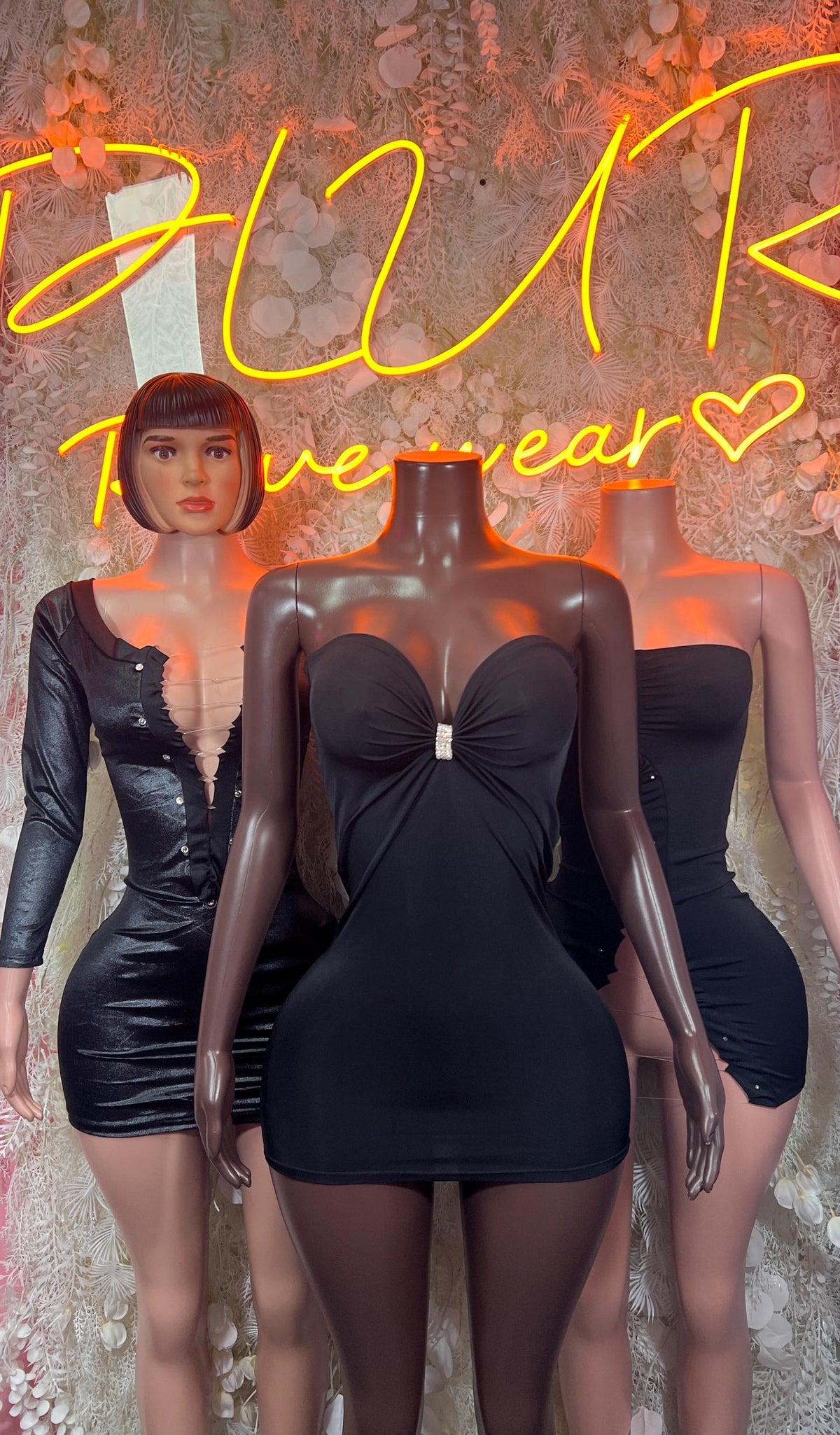 Black satin mini dress with twisted front bust detail and ruched waist