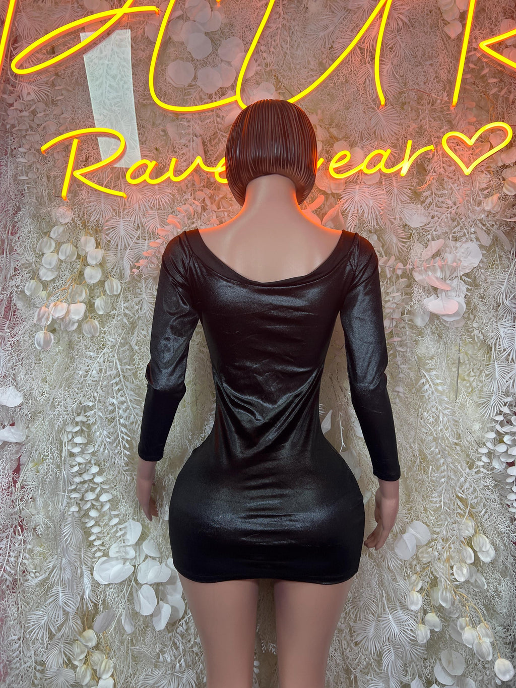 Black satin mini dress back view with open neckline and gathered waist seams