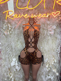 Leopard print one-piece bodysuit with crisscross straps and lace-up hip cutouts