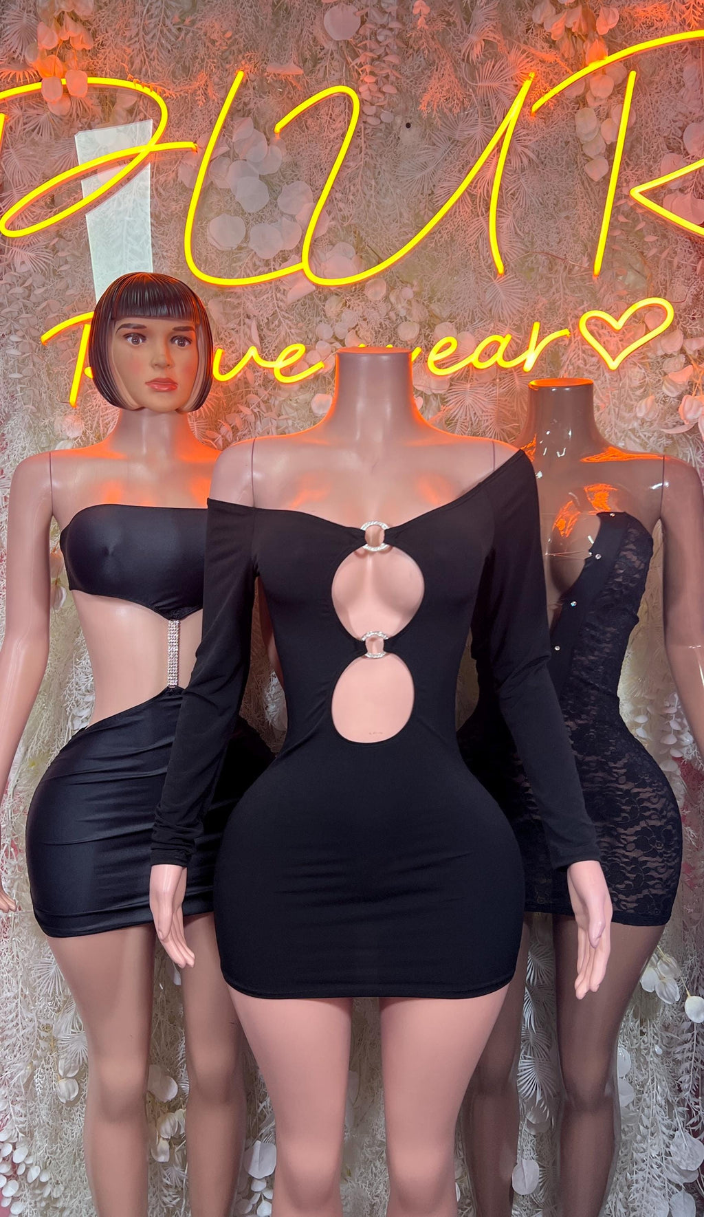 Black bodycon mini dress with lace bust and oval ring cutout