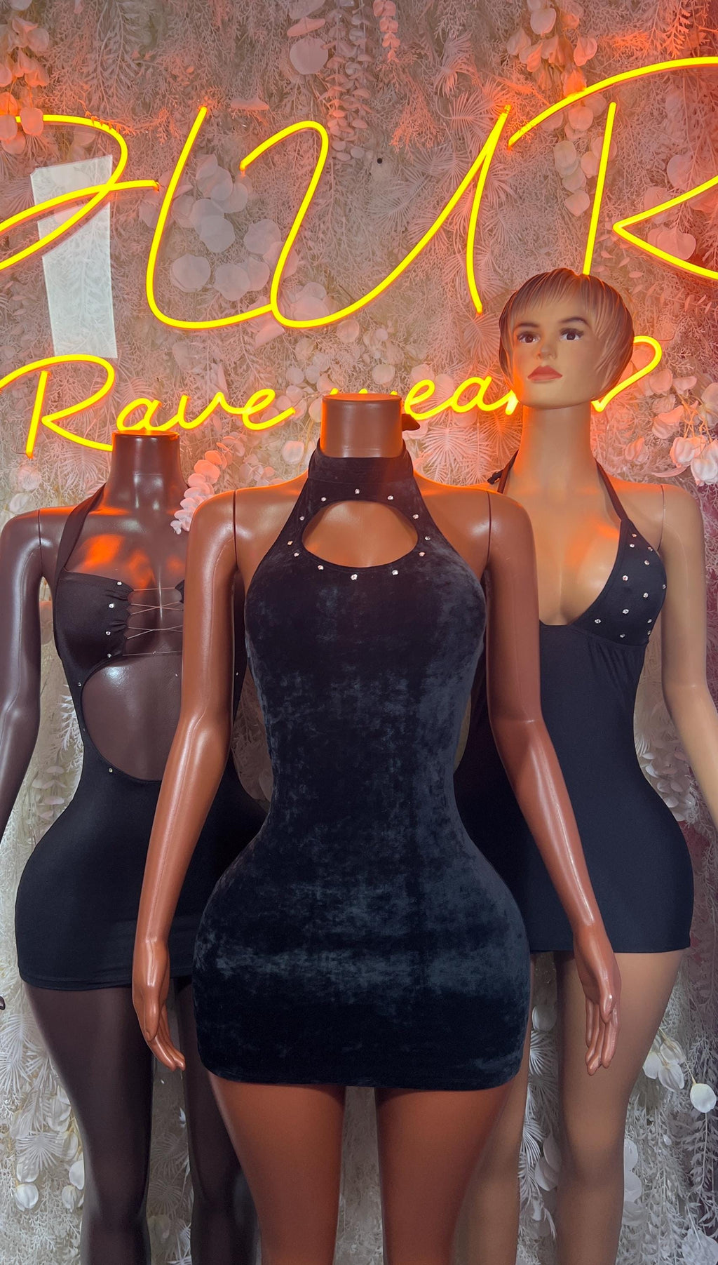 Black fitted bodycon mini dress with halter neckline and open back