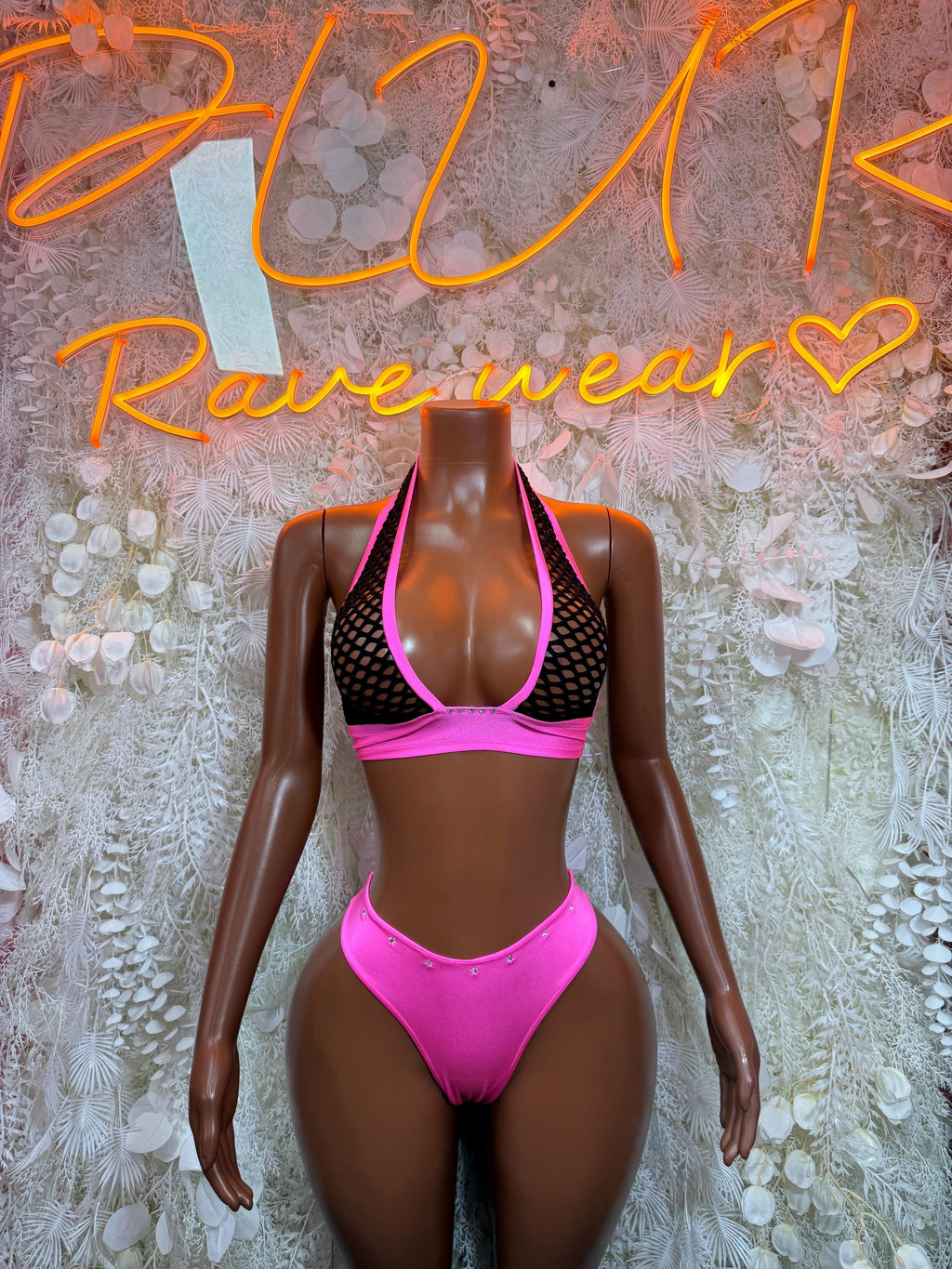 Pink-and-black rave two-piece set: mesh-trim bra top and matching high-cut bottoms