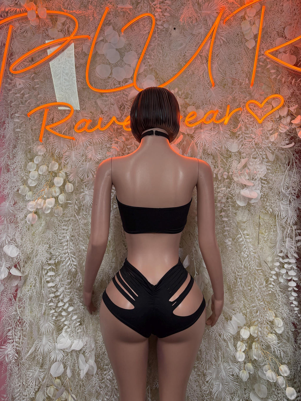 Black dancewear set, back view: bandeau top with cutout stripes, high-waist shorts