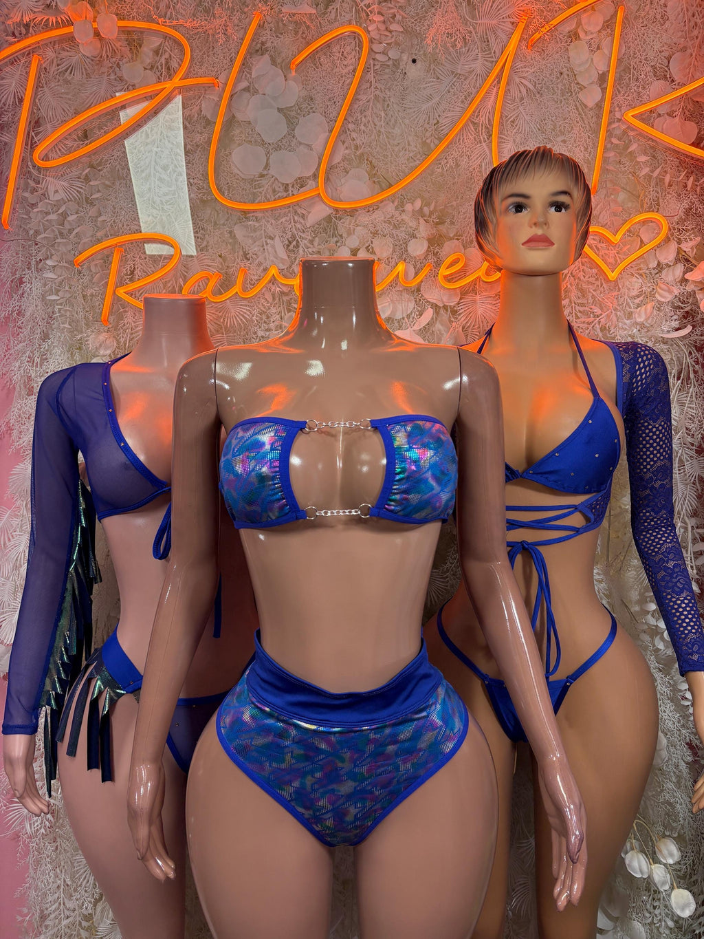 Navy blue two-piece dancewear set with patterned bra, high-cut bottoms, and sheer sleeves