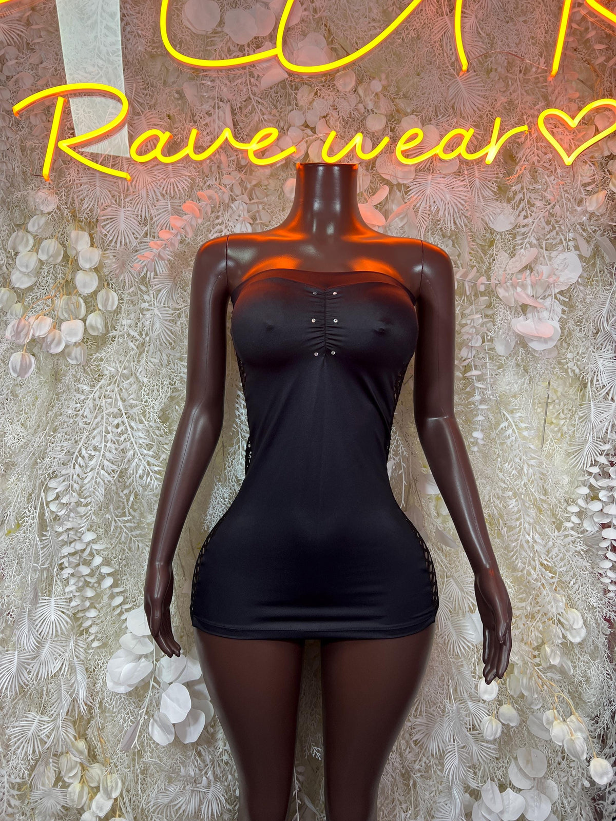 Black strapless mini dress with sweetheart neckline and front button detail