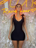 Black short sleeveless dress with bow shoulder straps and scoop neckline