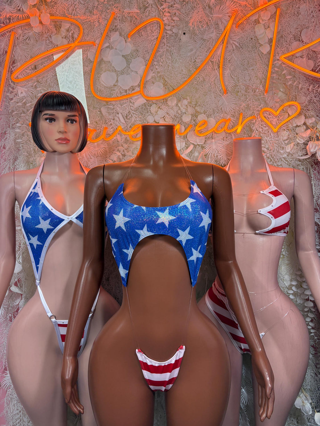 Star-spangled sling swimsuit with blue star top and red-white striped cutout