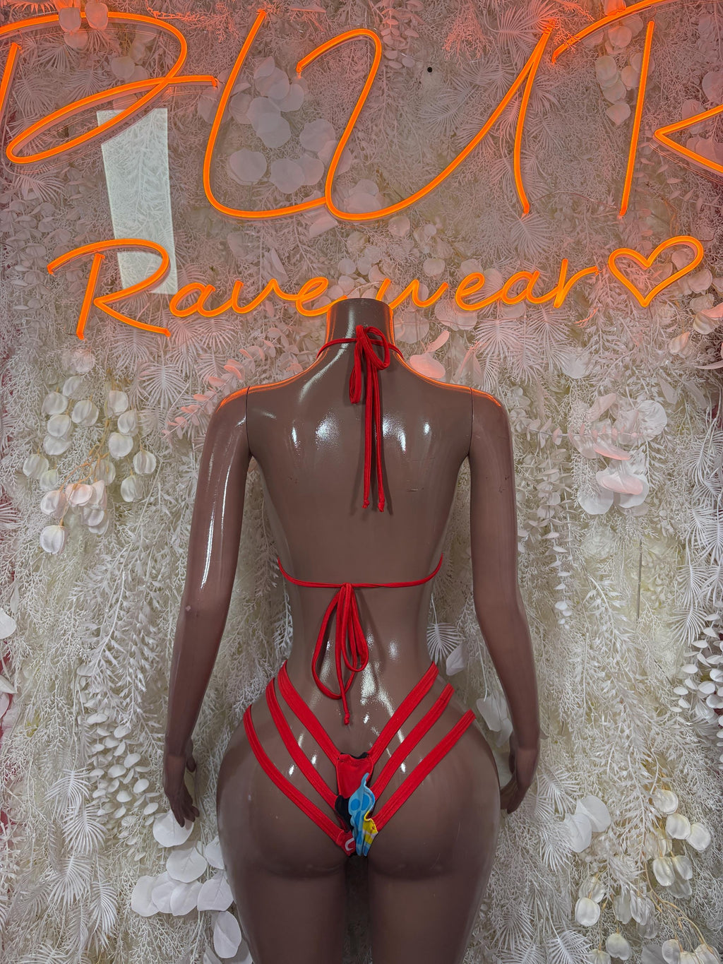 Rave two-piece set back view: red halter top with crisscross strap and tie, matching bottoms