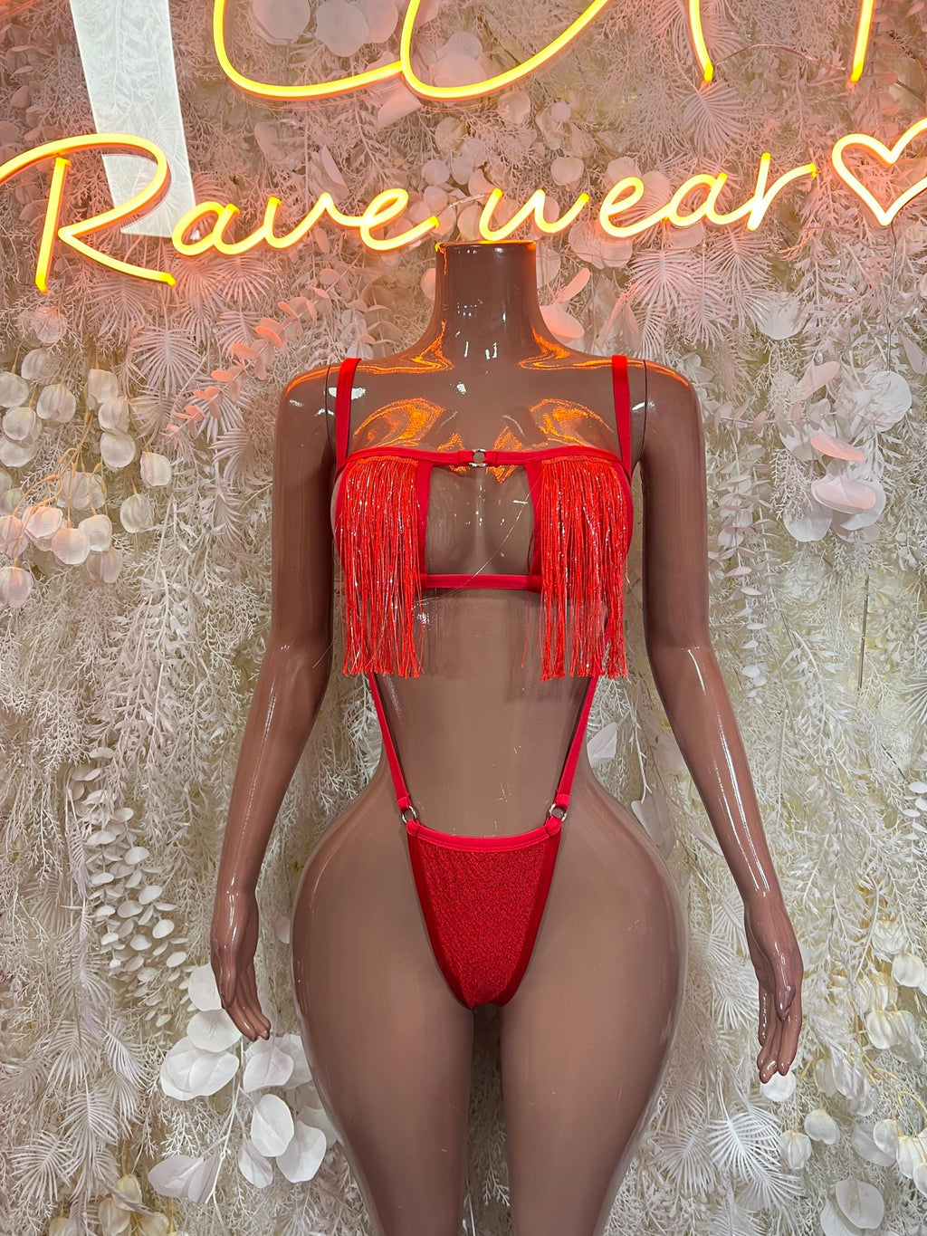 Red strappy one-piece dancewear with fringe trim and cutout front