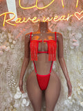 Red strappy one-piece dancewear with fringe trim and cutout front
