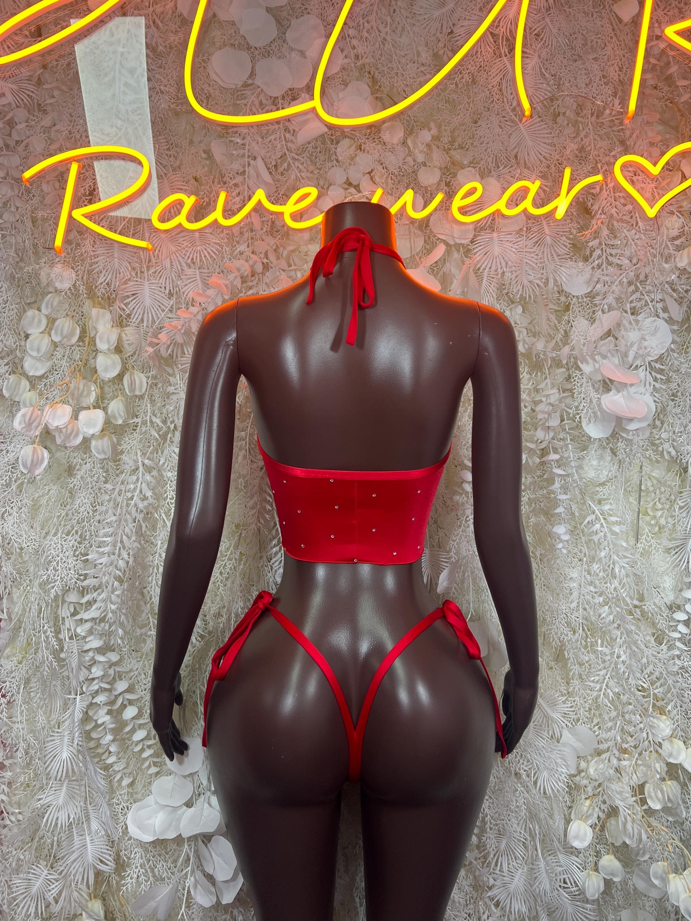 Red glitter bikini set with crop top and tie straps, back view on mannequin