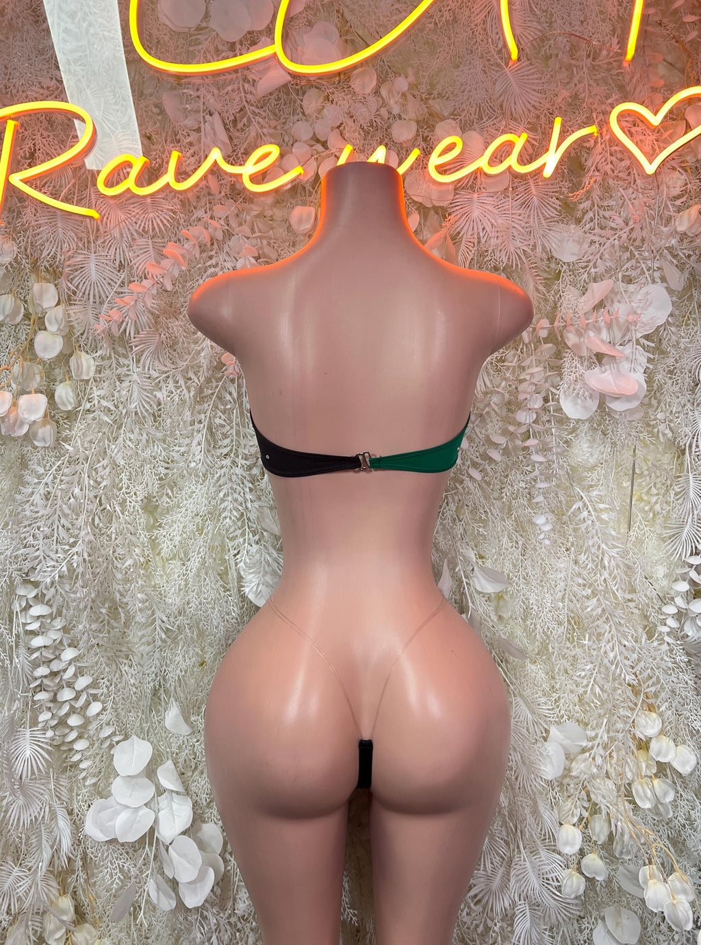 Back view of green, yellow and black knotted bandeau with black strap thong bottoms