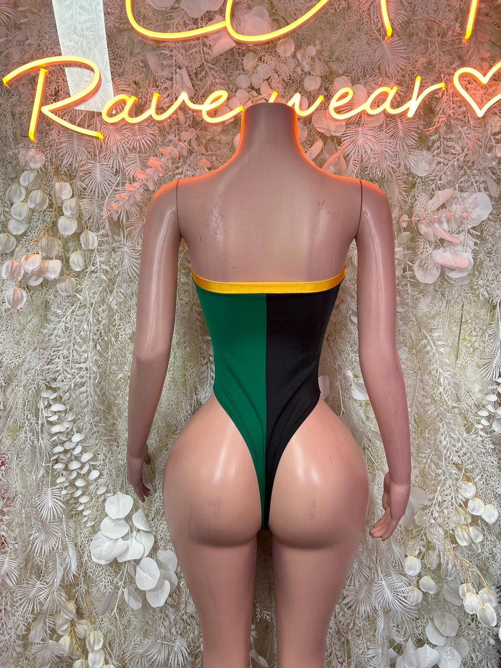 Jamaica flag one-piece bodysuit, back view with green center and black sides
