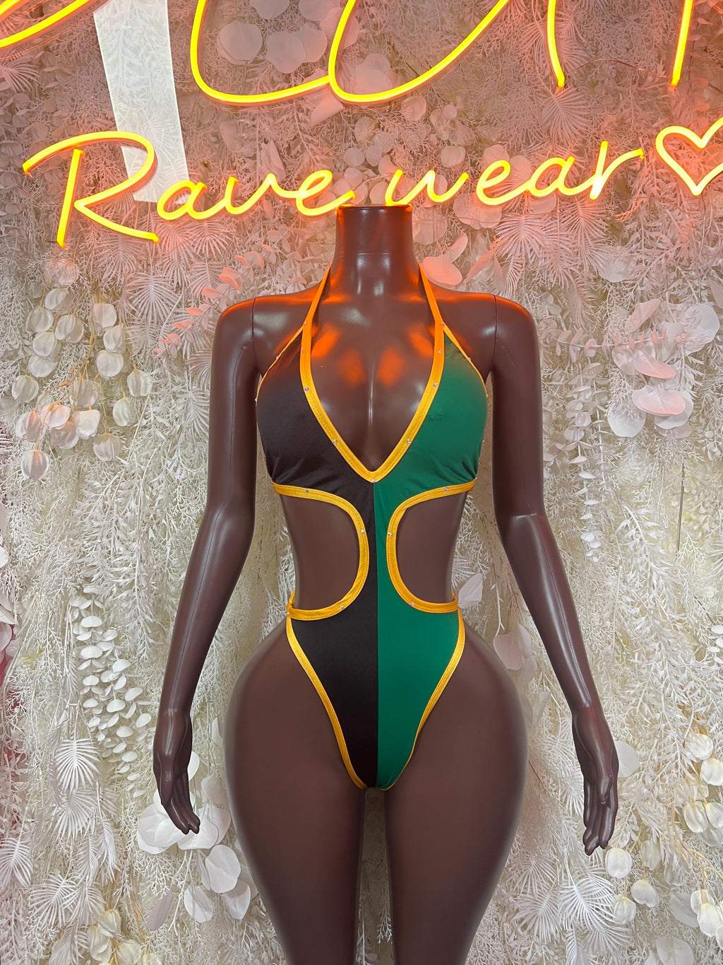 Women’s one-piece bodysuit, green V-neck with gold trim and black panels
