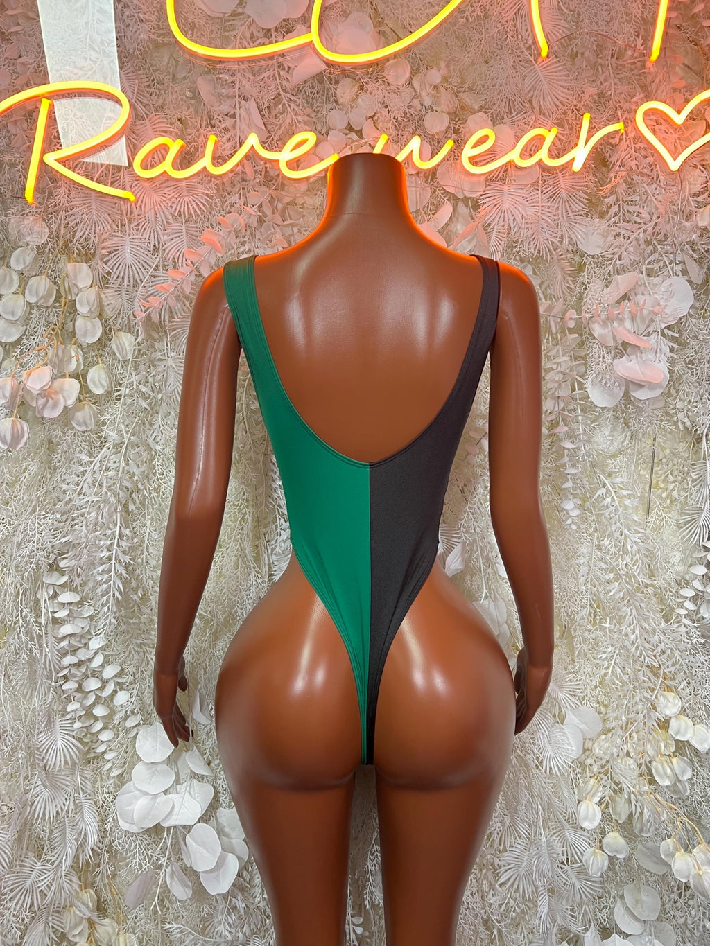 Back view Jamaican flag bodysuit, green center panel with black sides, low-cut open back
