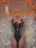 Black cheetah-print bodysuit with lace-up V neckline and tie shoulder straps
