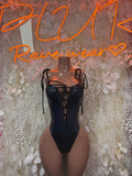 Black cheetah print bodysuit with lace-up back straps and eyelet cutout