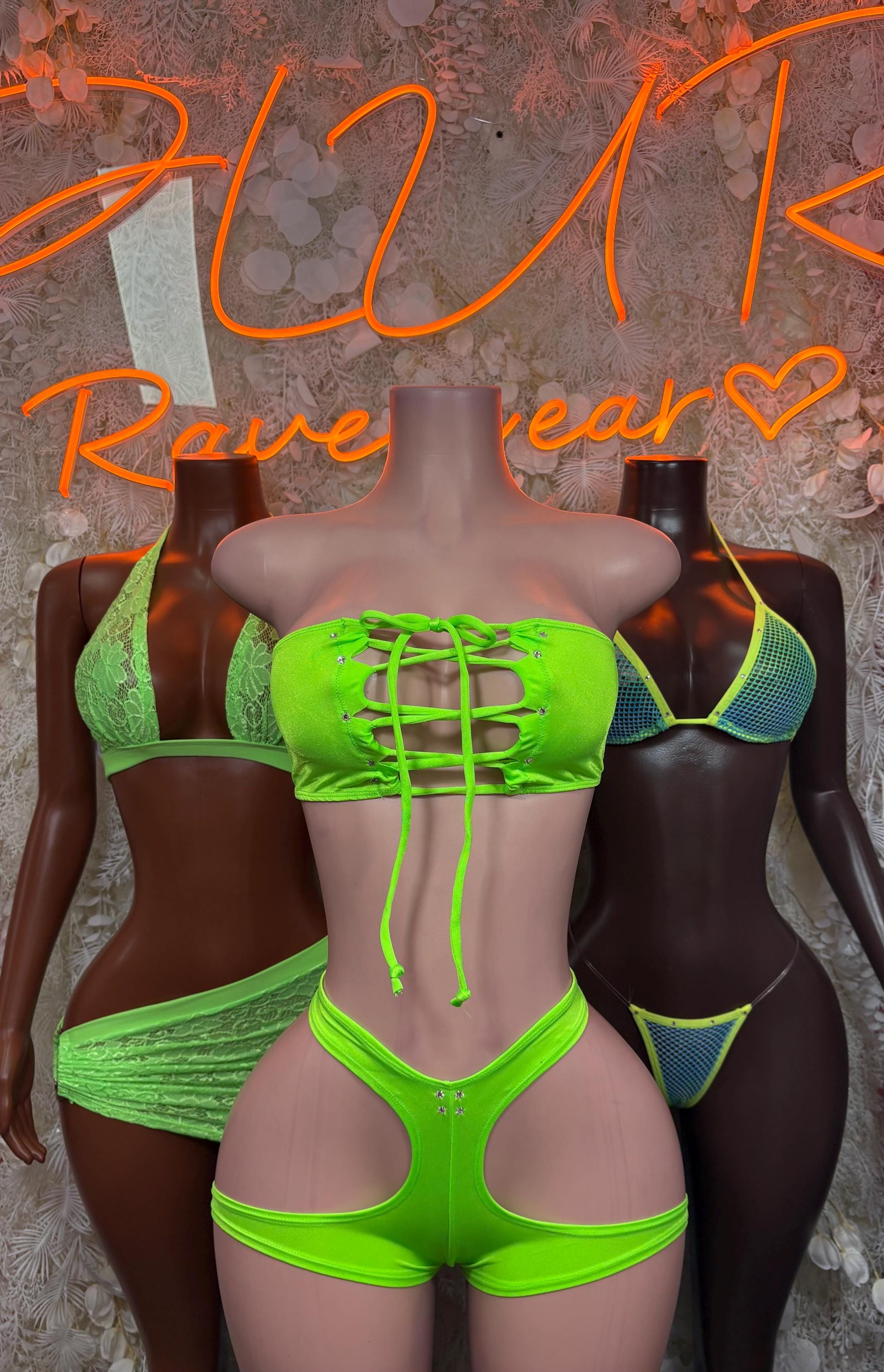Neon green lace-up bikini top and matching high-waist bottom, sparkly texture.