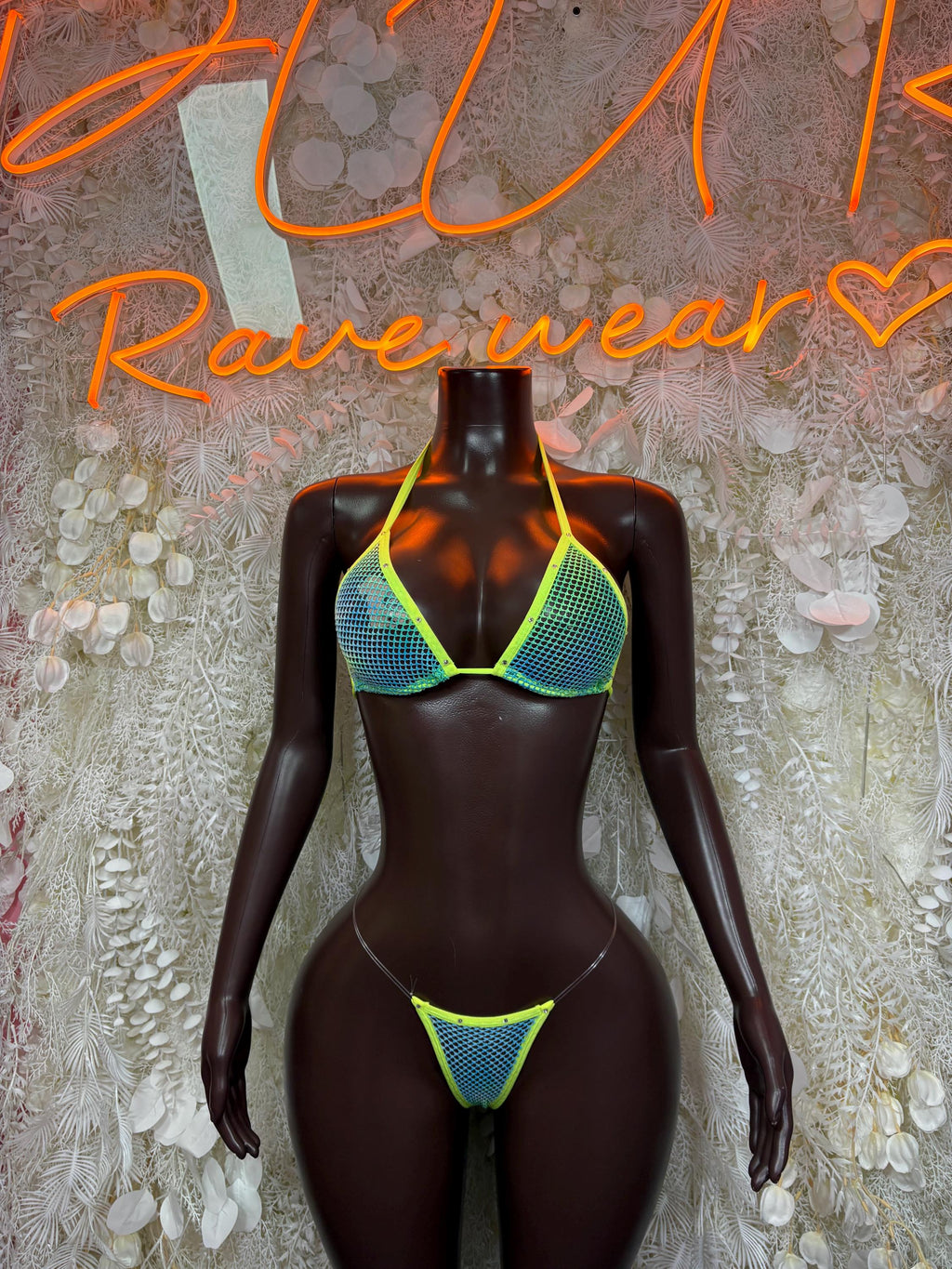 Neon green strappy bikini top and matching high-cut bottom with neon trim.