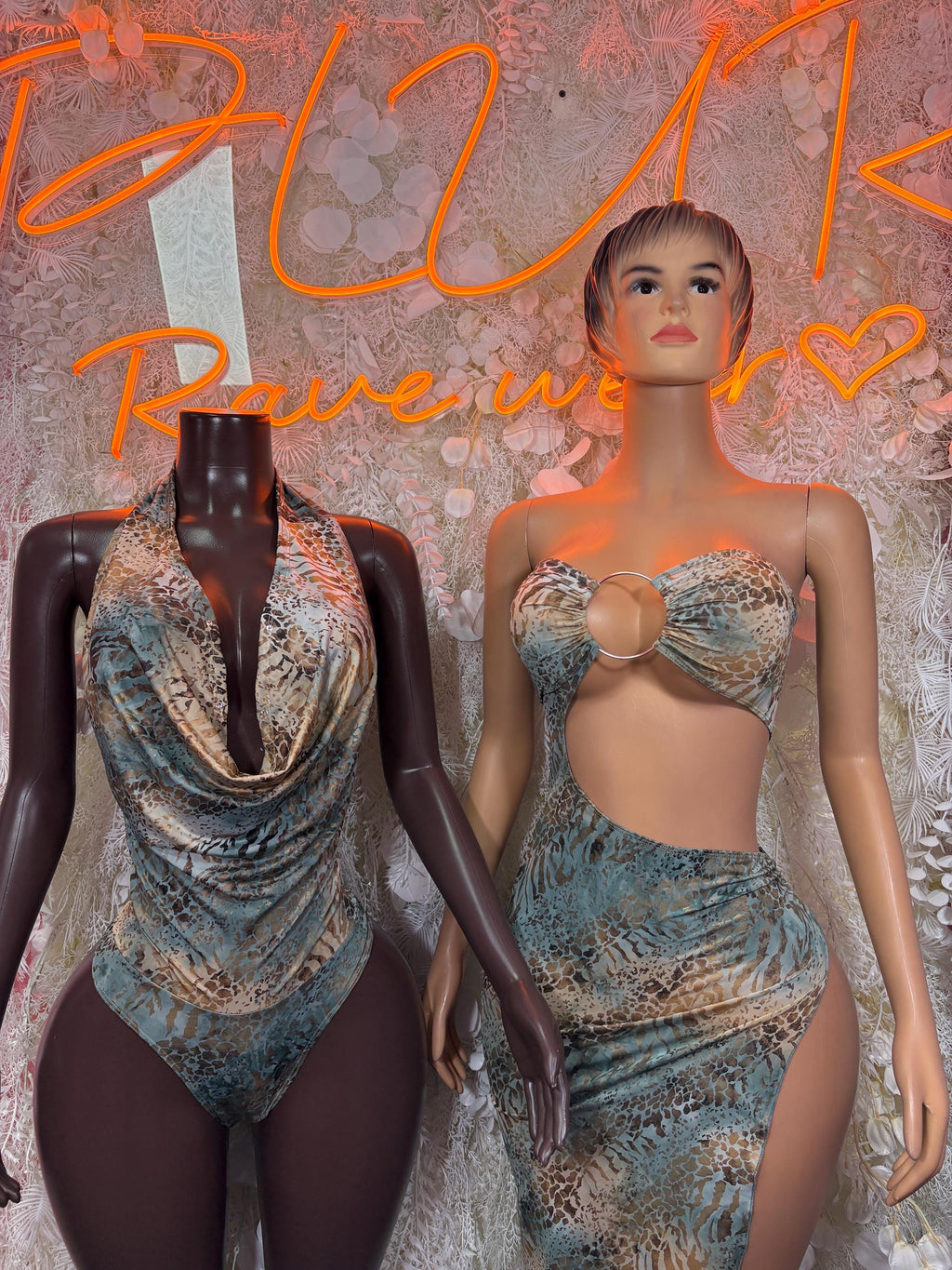 Rave dress on model and mannequin: blue-toned ring bra top with draped skirt