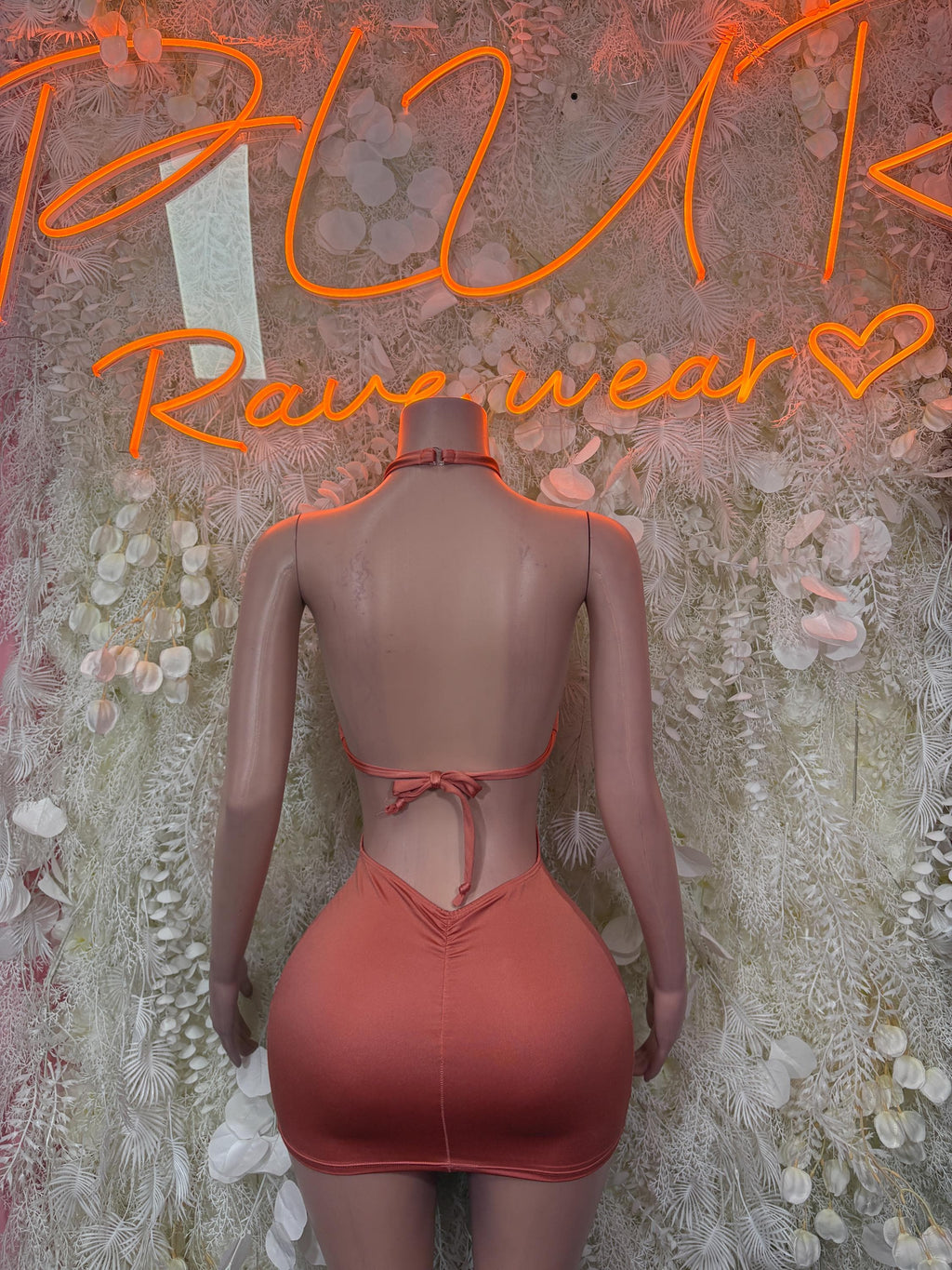 Coral halter neck bodycon mini dress, open back with ruched seams