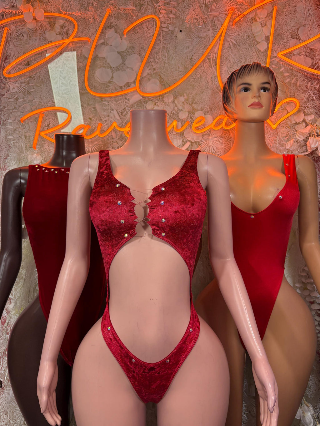 Red studded one-piece dancewear bodysuit with button-front detail, high-leg cutout