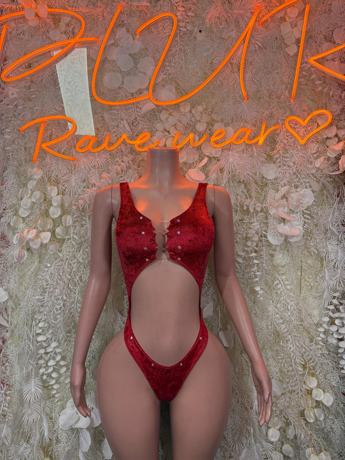 Red one-piece bodysuit with deep scoop neckline, studded detailing, high-leg cutout