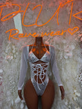 Silver cheetah print bodysuit with long sleeves and front lace-up cutout