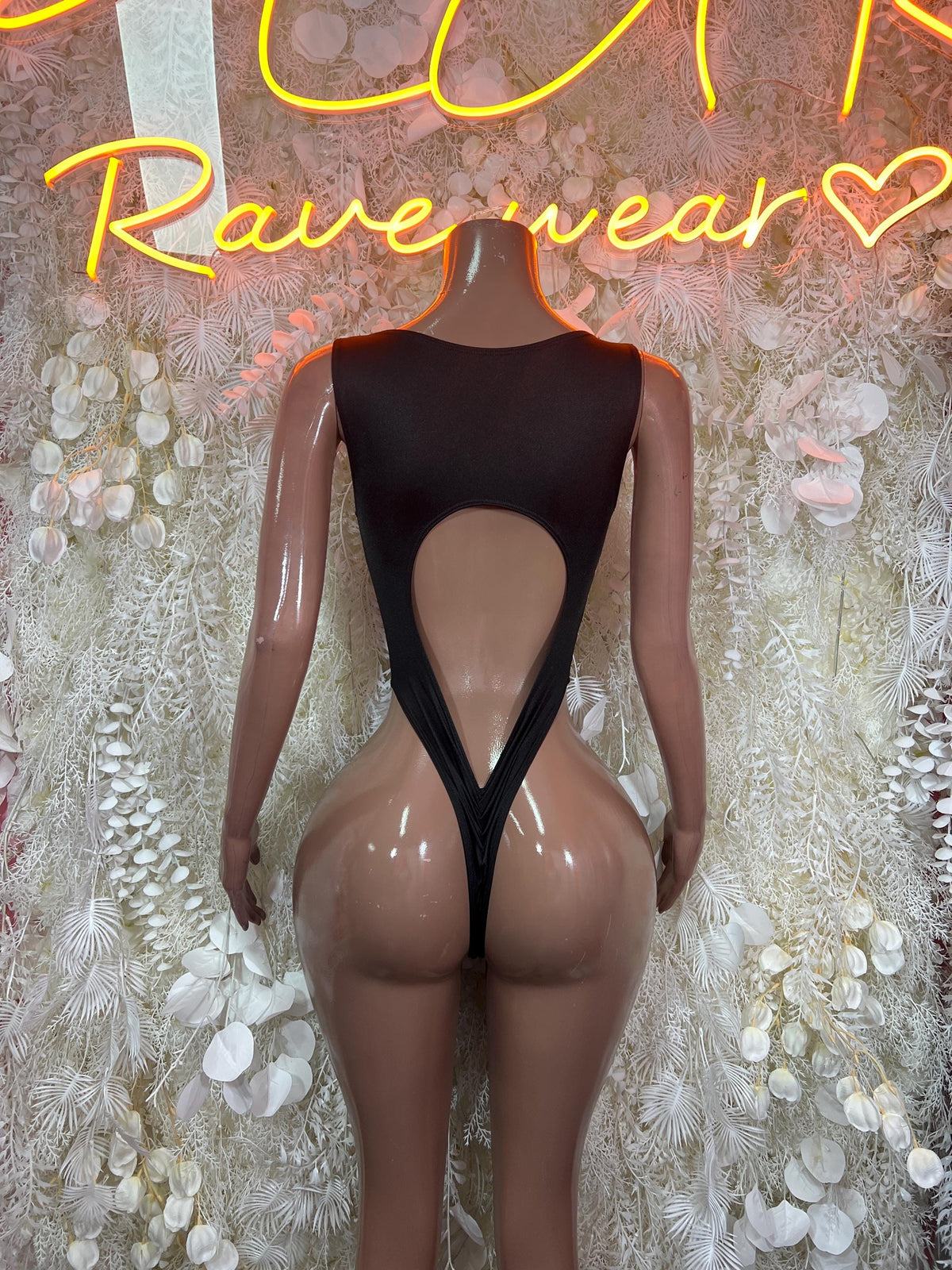 One-piece bodysuit back view, black with red lightning print and teardrop open-back cutout