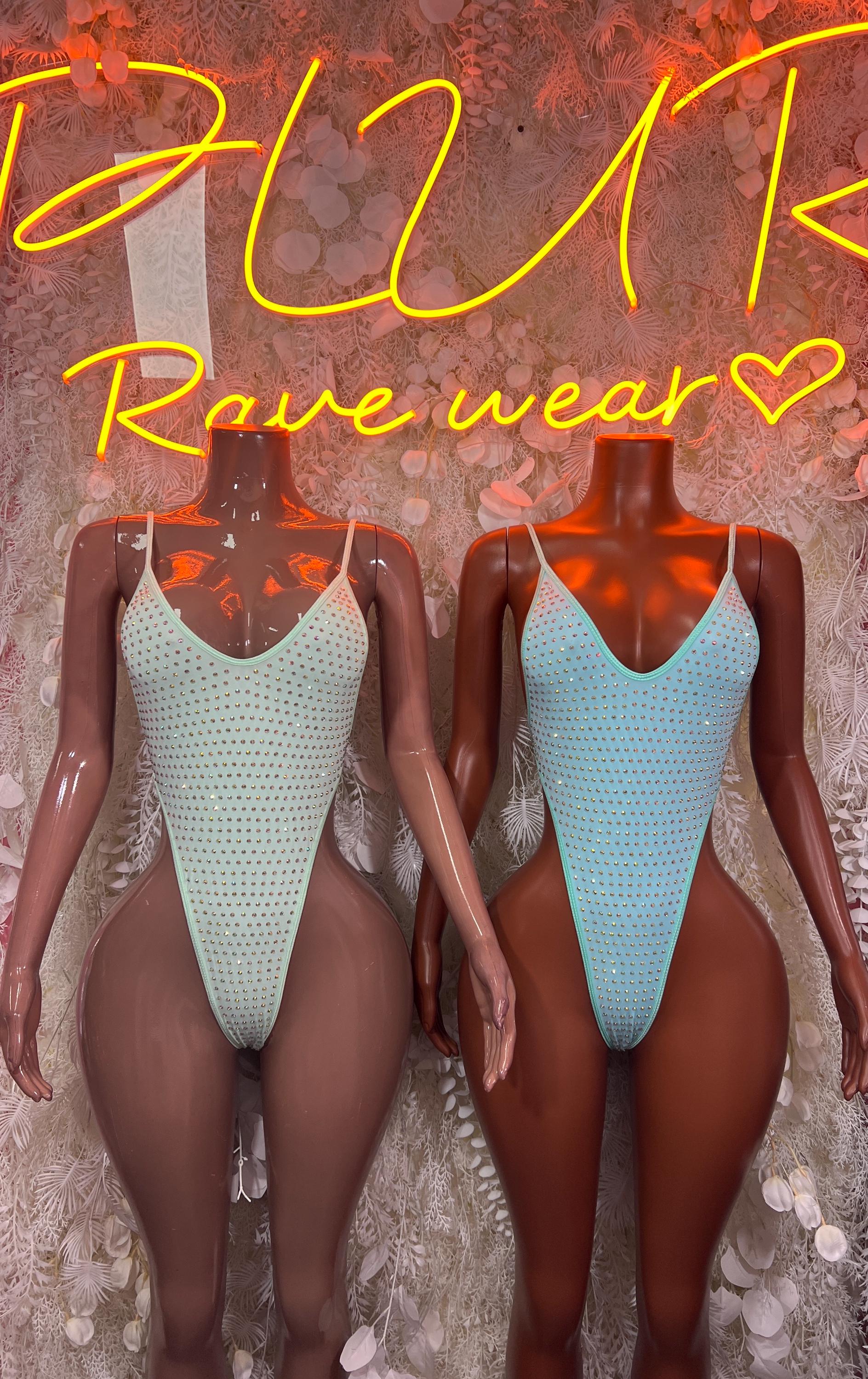 Teal rhinestone bodysuit on mannequins, front V neckline and high-cut one-piece